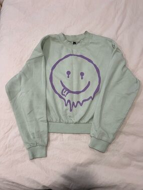 H&M
Mint Green Crop Sweatshirt with Purple Drippy Smile Graphic